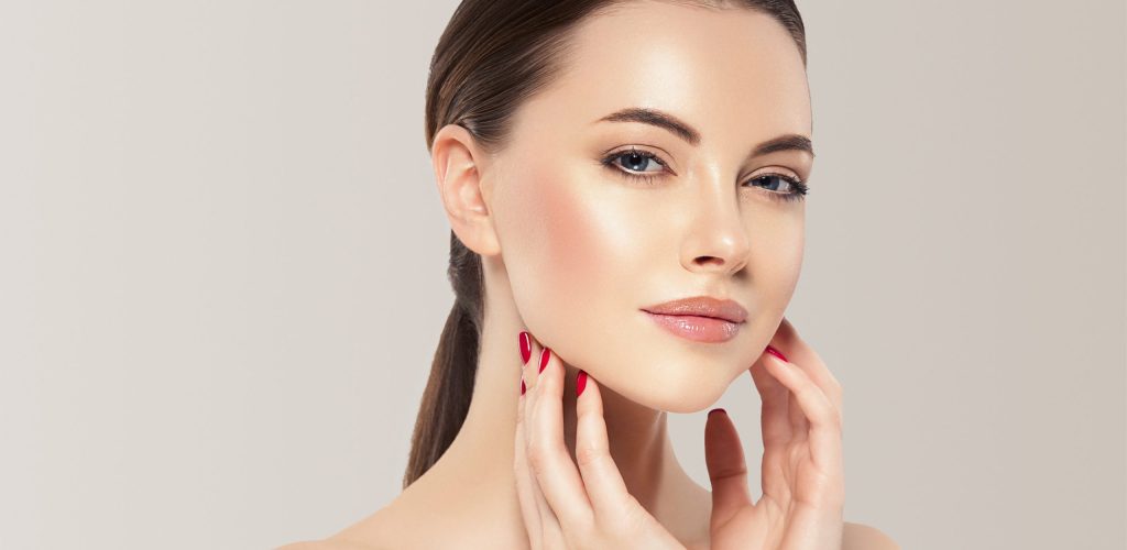 A close-up portrait of a woman with healthy, glowing skin texture reflecting the natural results of a non-surgical facelift.