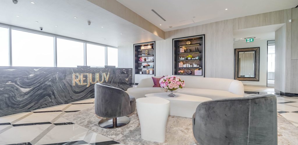 The elegant and welcoming reception desk area at a premier Toronto medical spa location.